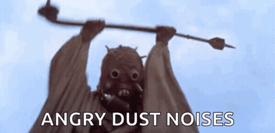 Monster Statue Holding Stick With Angry Dust Noises GIF