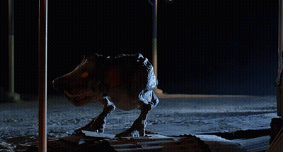 Monster Statue With Letter T On Face GIF