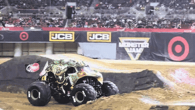 Monster Truck Driving Down Dirt Track At JCB Monster Jam GIF