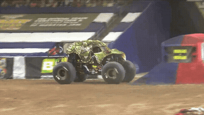 Monster Truck Driving Down Dirt Track Past Sign Saying B GIF