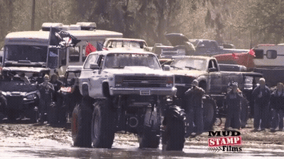 Monster Truck Driving Through Mud With Mud Stamp Films GIF