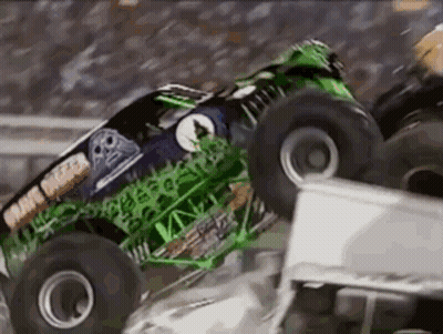 Monster Truck Grave Digger Crashing Into White Truck GIF