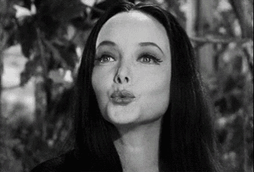 Morticia Kisses GIF
