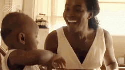 Mother Forehead Kiss To Her Playing Son