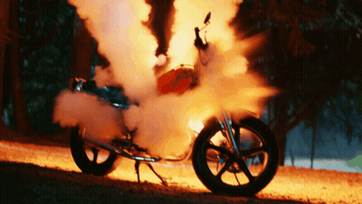 Motorcycle On Fire With Smoke From Wheel GIF