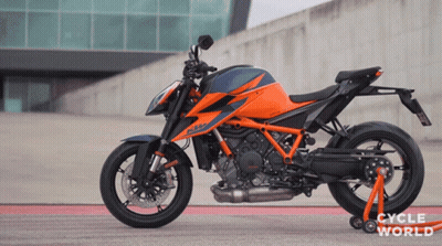 Motorcycle Parked In Front Of Cycle World Building GIF