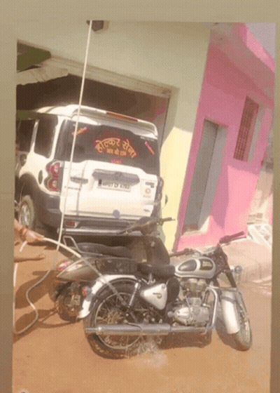 Motorcycle Parked In Front Of White SUV With License Plate J07 DF 6113 GIF