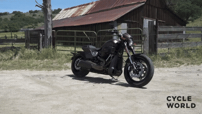 Motorcycle Parked On Dirt Road By Barn With Cycle World GIF