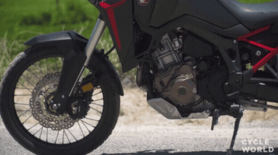 Motorcycle Parked On Road With Cycle World GIF