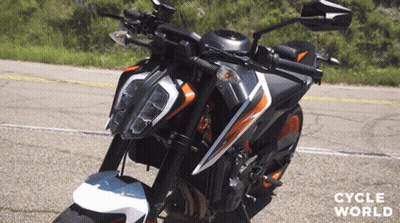 Motorcycle Parked On Road With Cycle World GIF