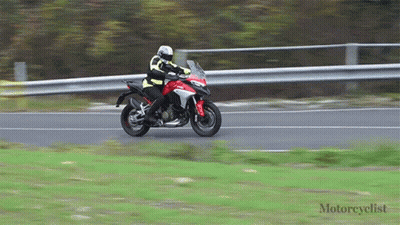 Motorcyclist Riding Red Motorcycle GIF