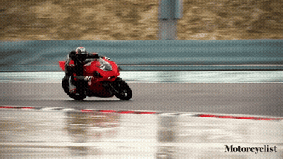 Motorcyclist Riding Red Motorcycle On Wet Track GIF