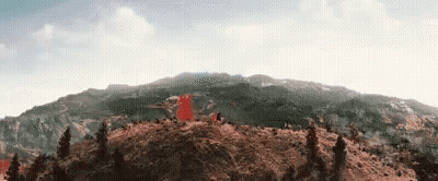 Mountain With Trees And Red Flag GIF