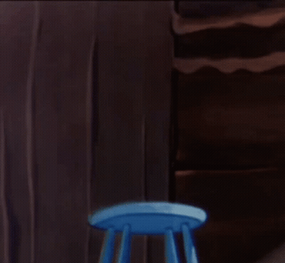Mouse In Diaper Holding Dunce Towel On Blue Stool GIF