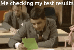 Mr. Bean Checking Test Results GIF