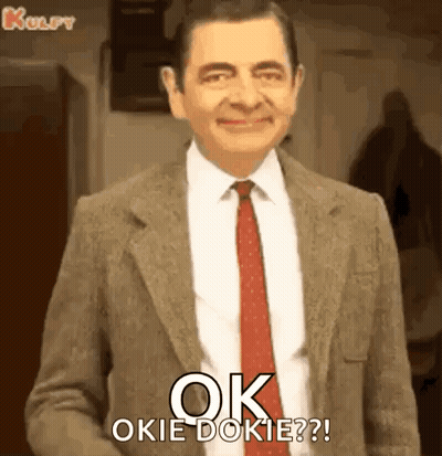 Mr Bean Is Wearing A Suit And Tie And Says `` Ok Okie Dokie ? '' GIF