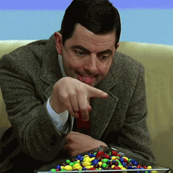 Mr. Bean Picking Candy GIF