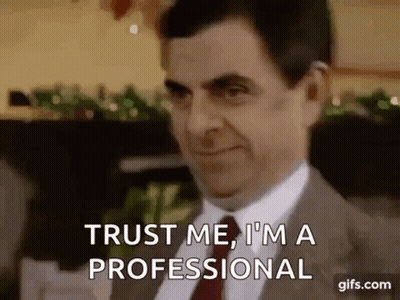 Mr Bean Saying Trust Me I'm A Professional In Suit And Tie GIF