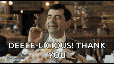 Mr Bean Sitting At Table Making Funny Face GIF