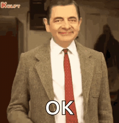 Mr Bean Smiling And Saying Ok GIF
