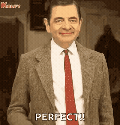 Mr Bean Smiling And Saying Perfect GIF