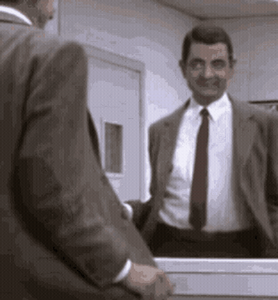 Mr Bean Smiling In Front Of Mirror GIF