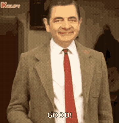 Mr Bean Smiling In Suit And Tie GIF