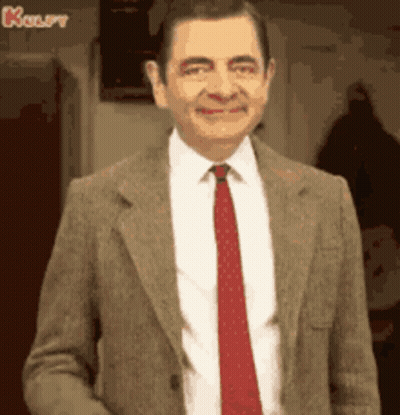 Mr Bean Smiling In Suit And Tie GIF