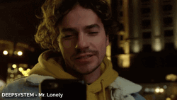 Mr Lonely Sending Kisses In Phone GIF