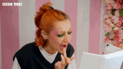 Mua Puts Lipstick Using Hands GIF