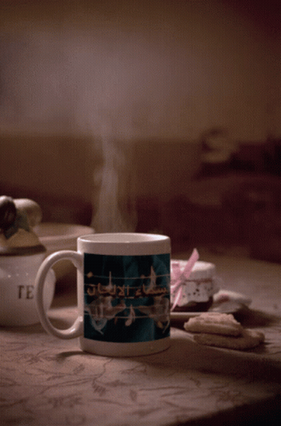 Mug With Music Notes Next To Cookies GIF