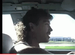Mullet Haired Man Driving GIF
