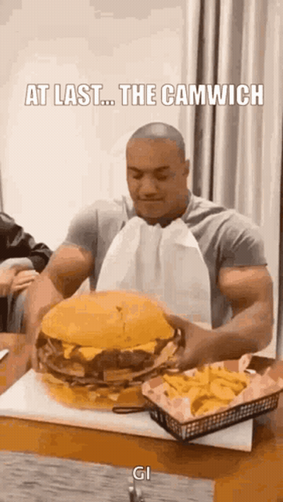Muscular Man Eating Giant Hamburger And French Fries GIF