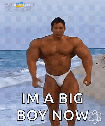 Muscular Man In Bikini On Beach GIF