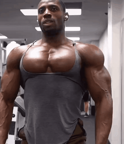 Muscular Man In Gray Tank Top At Gym GIF