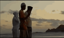 Muslim People Praying To The Sea