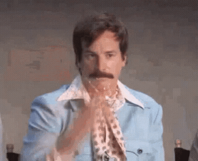 Mustached Man Clapping In Blue Jacket Leopard Scarf GIF