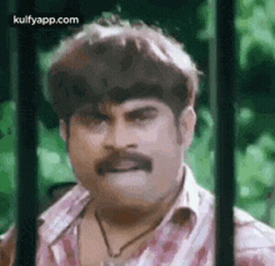 Mustached Man Funny Face Behind Bars GIF