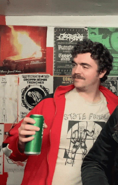 Mustached Man Holding Green Can Skate Funk Shirt GIF