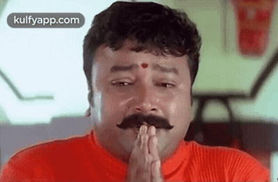 Mustached Man In Red Shirt Praying With Folded Hands GIF