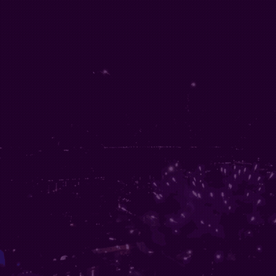 Muzikal On Purple Background With Fireworks GIF