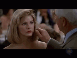 Naked Gun Frank Drebin Pinching Jane Spencer Cheek GIF