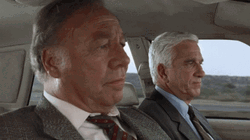 Naked Gun Frank Drebin With Captain Ed Hocken GIF