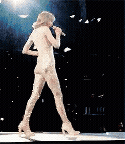 Naked Woman Singing Into Microphone On Stage GIF