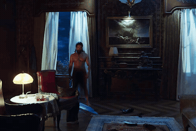 Naked Woman Standing In Room With Lamp GIF