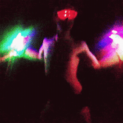 Naked Woman Wearing Glow Goggles GIF