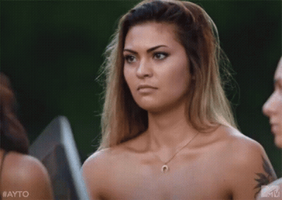 Naked Woman With Horseshoe Necklace Beside Two Naked Women GIF