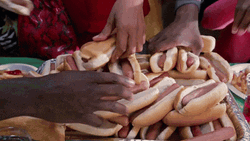National Hot Dog Day Lady Getting Sandwich GIF