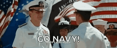 Navy Officers Talking In Front Of American Flag GIF
