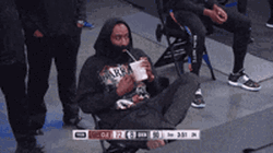 NBA Basketball Player James Harden Drinking And Watching Basketball Game GIF